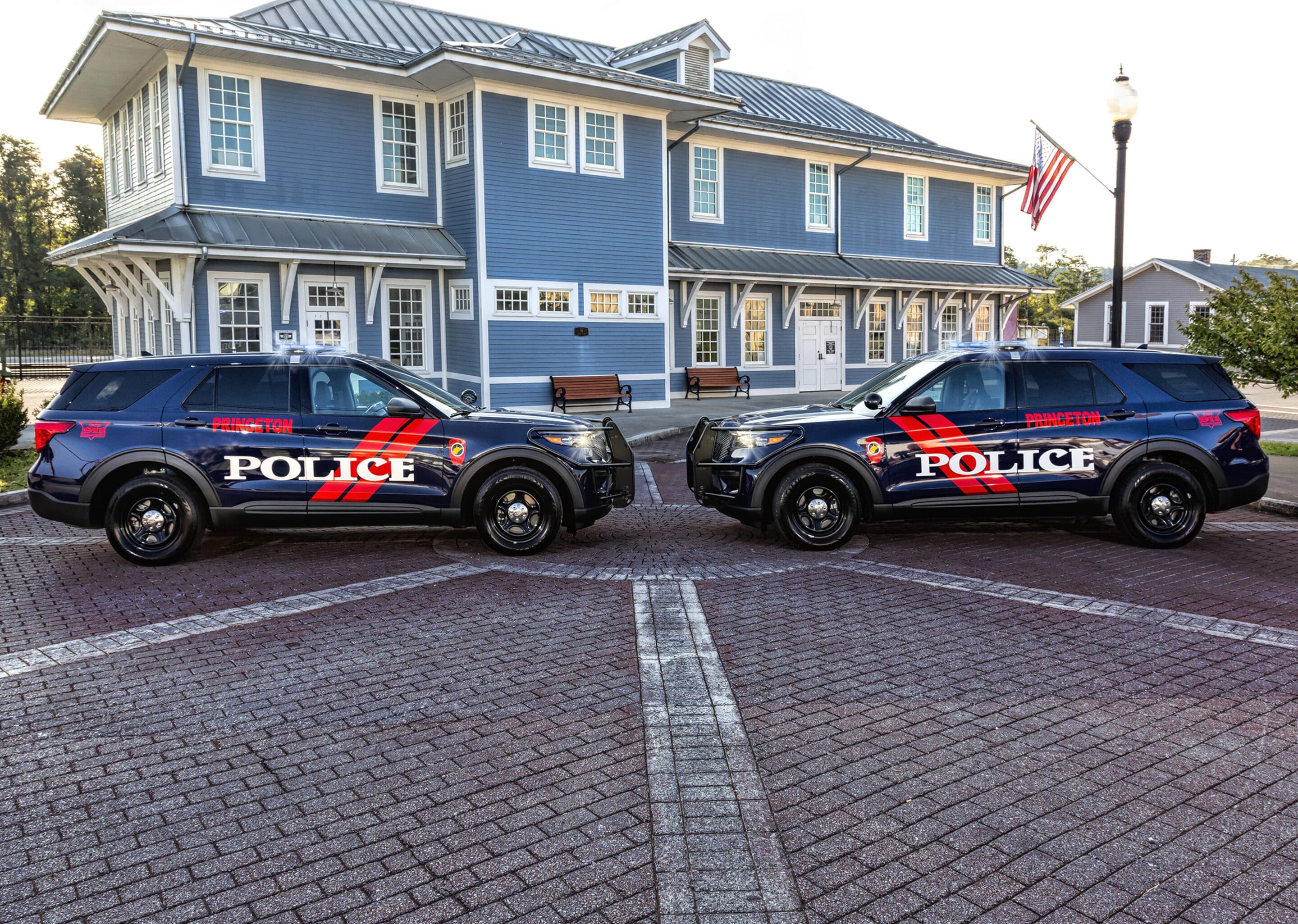 Two Princeton Police Department cruisers in front of the Railroad Museum.