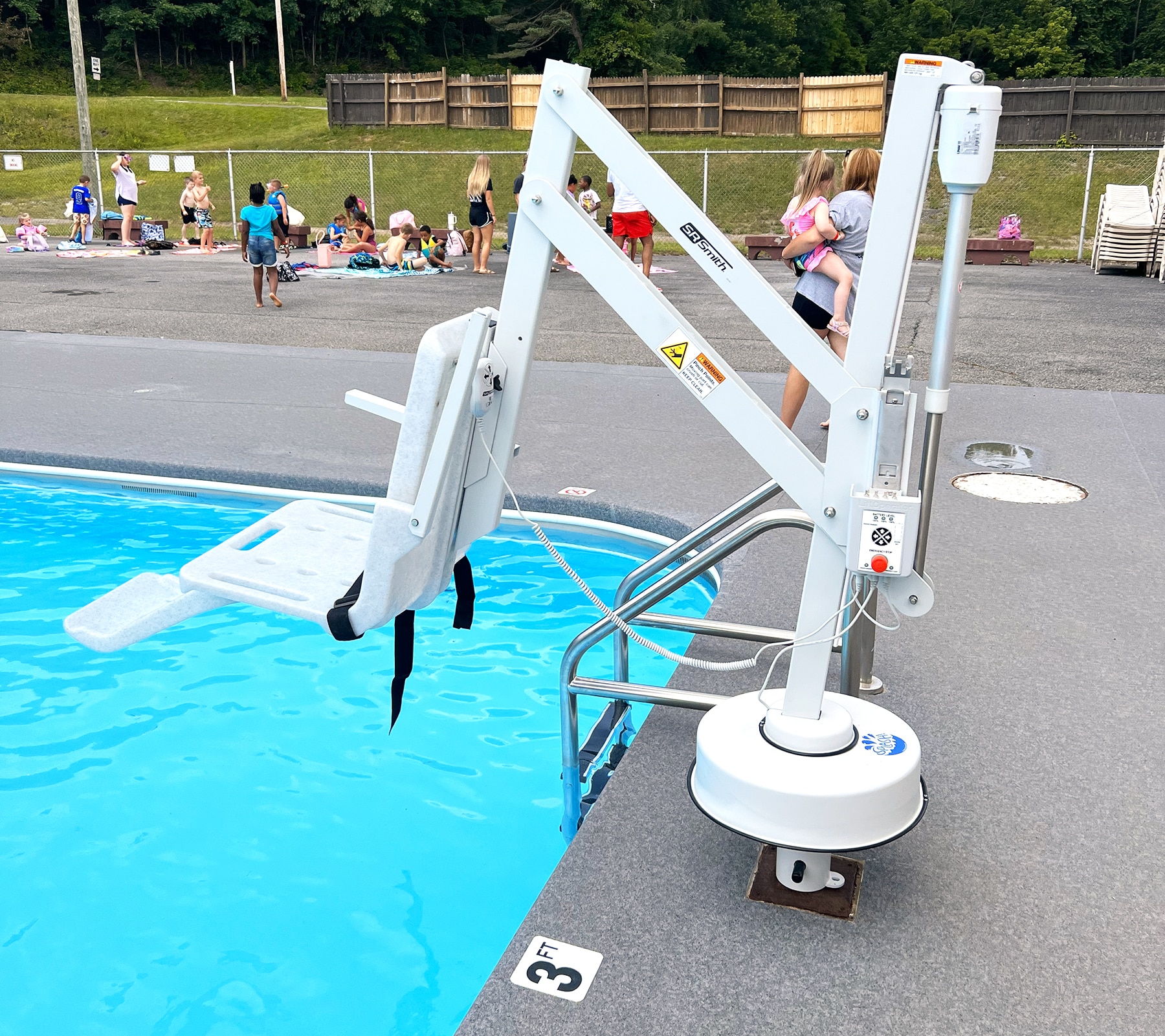 An automated chair lift at Princeton City Pool.